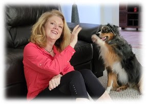 Photo of the author, Niki Tudge, and her dog.