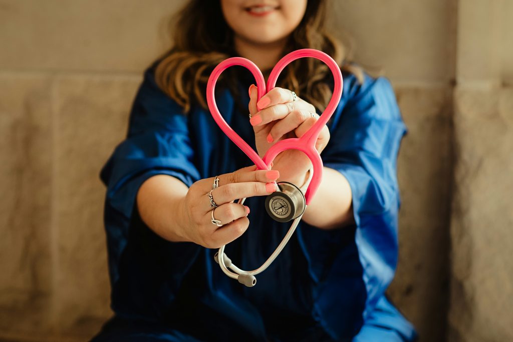 Stethoscope being held in the shape of a heart